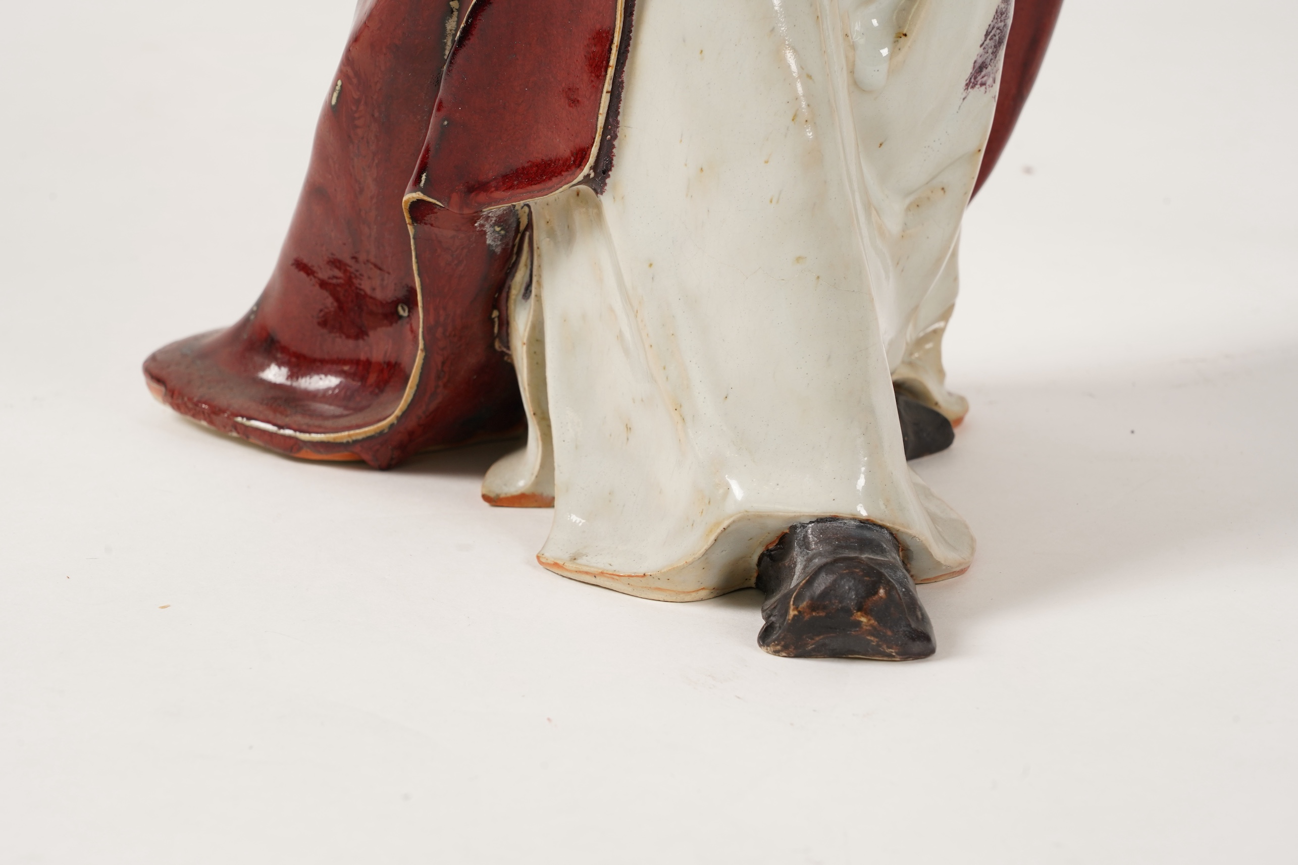 A large Chinese Shiwan stoneware figure of a warrior, 20th century